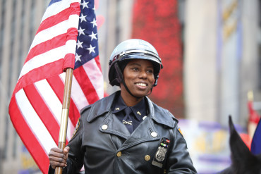 A NYPD officer rides in the Macy's Thanksgiving Day Parade.