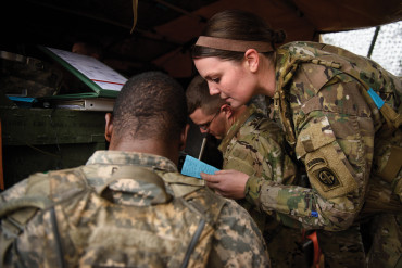 Bessler and her soldiers work on a fire support coordination exercise. Bessler was the only woman in the field during the exercise.