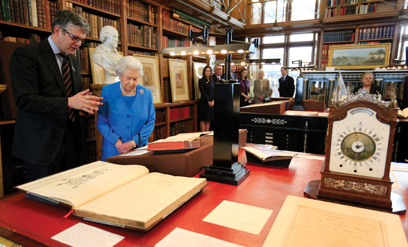 SHHHH: Queen Elizabeth II joins Royal Librarian Oliver Urquhart Irvine in Windsor Castle’s Royal Library for a look at the Georgian papers.
