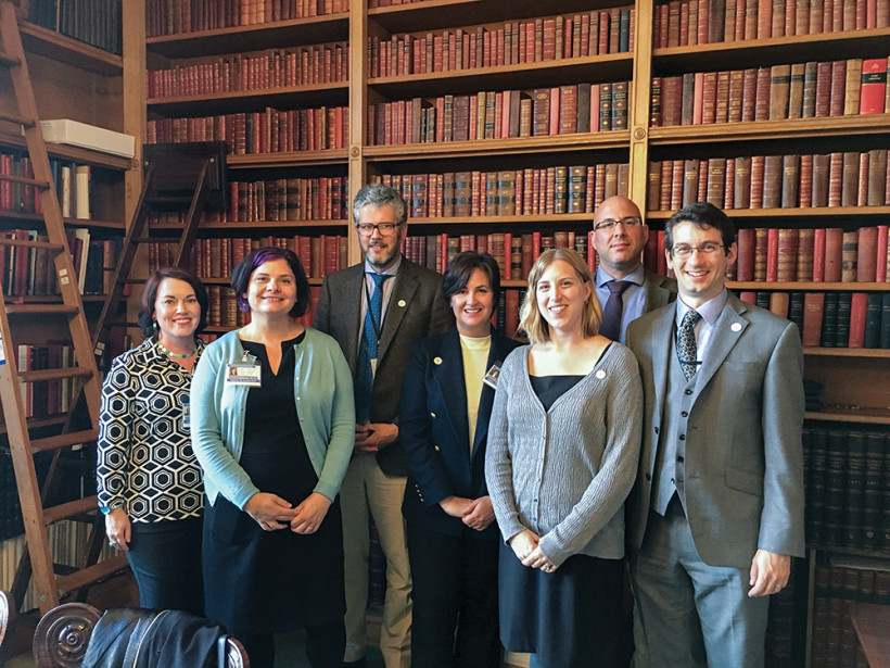 W&M IN THE UK: At left, W&M Libraries staff and faculty at Windsor Castle in 2016. From left: Kim Sims, university archivist; Debbie Cornell, W&M Libraries head of digital services; Oliver Urquhart Irvine, royal librarian; Carrie Cooper, dean of university libraries; Tami Back, W&M Libraries director of communications and strategic planning; Nick Popper, associate professor of history; and Oliver Walton, Georgian Papers Programme project manager and curator. 