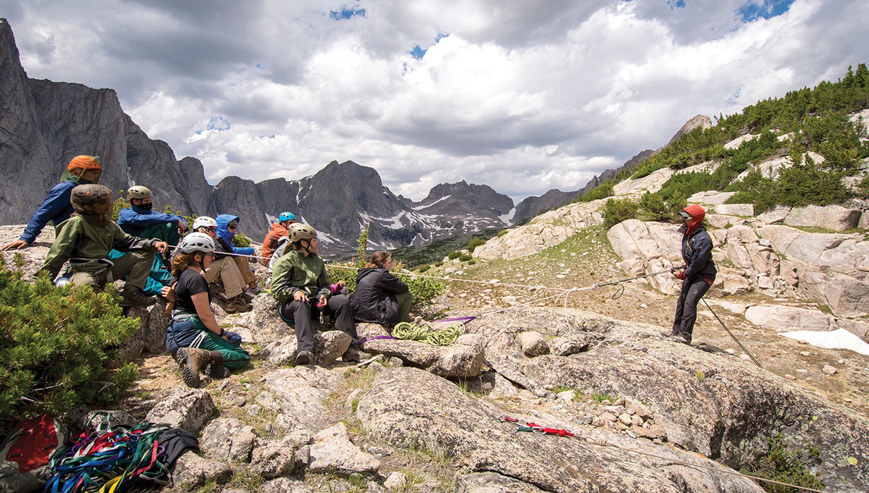 ABOVE IT ALL: A NOLS instructor teaches rappelling during a wilderness expedition in the Rocky Mountains. Photo courtesy of Jared Steinman/NOLS.