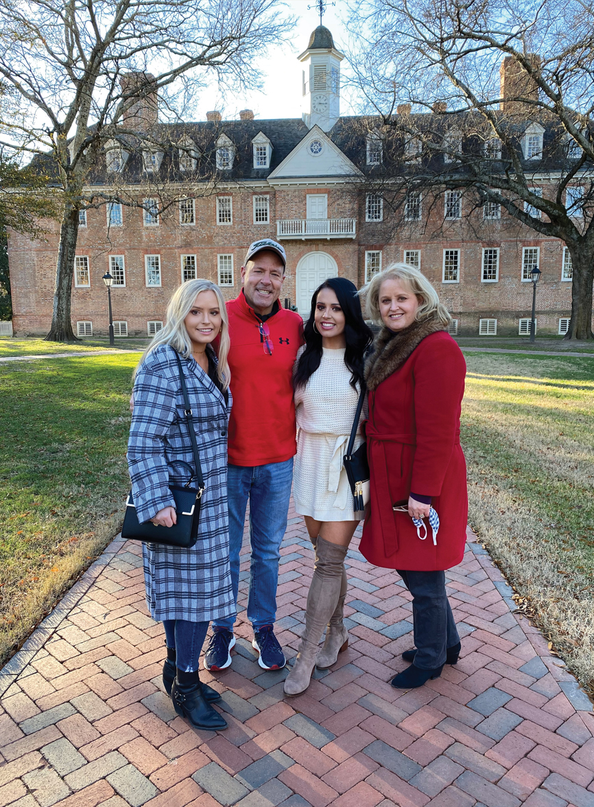 BACK IN THE ’BURG: Billy Coleburn ’90 and Joyce Anzolut Coleburn ’90 visited William & Mary in 2020 with their daughters, Mary Katherine (left) and Caroline.