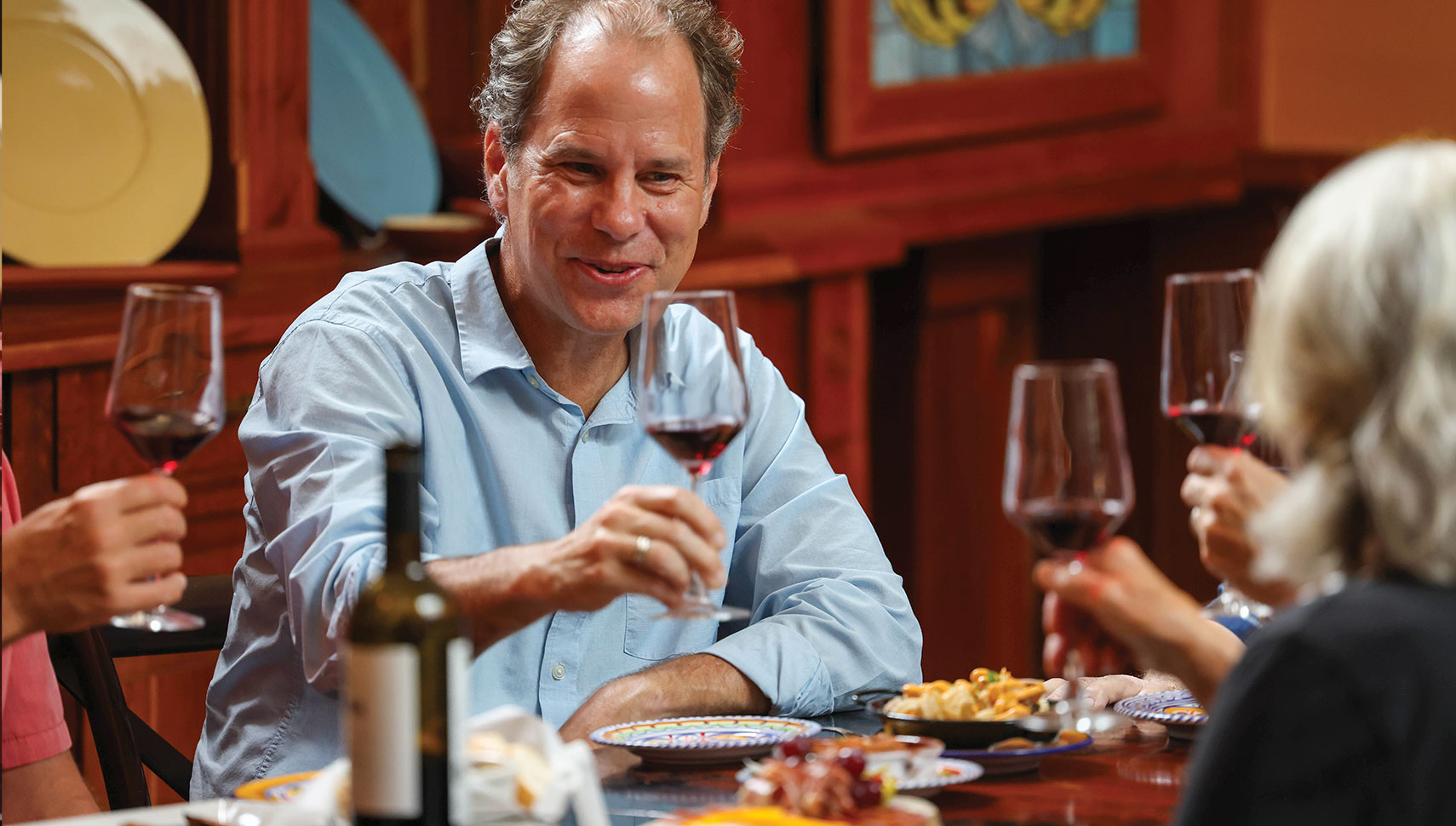 SALUD!: Jonathan Harris raises a toast with family members at La Tienda Tapas Bar & Market.