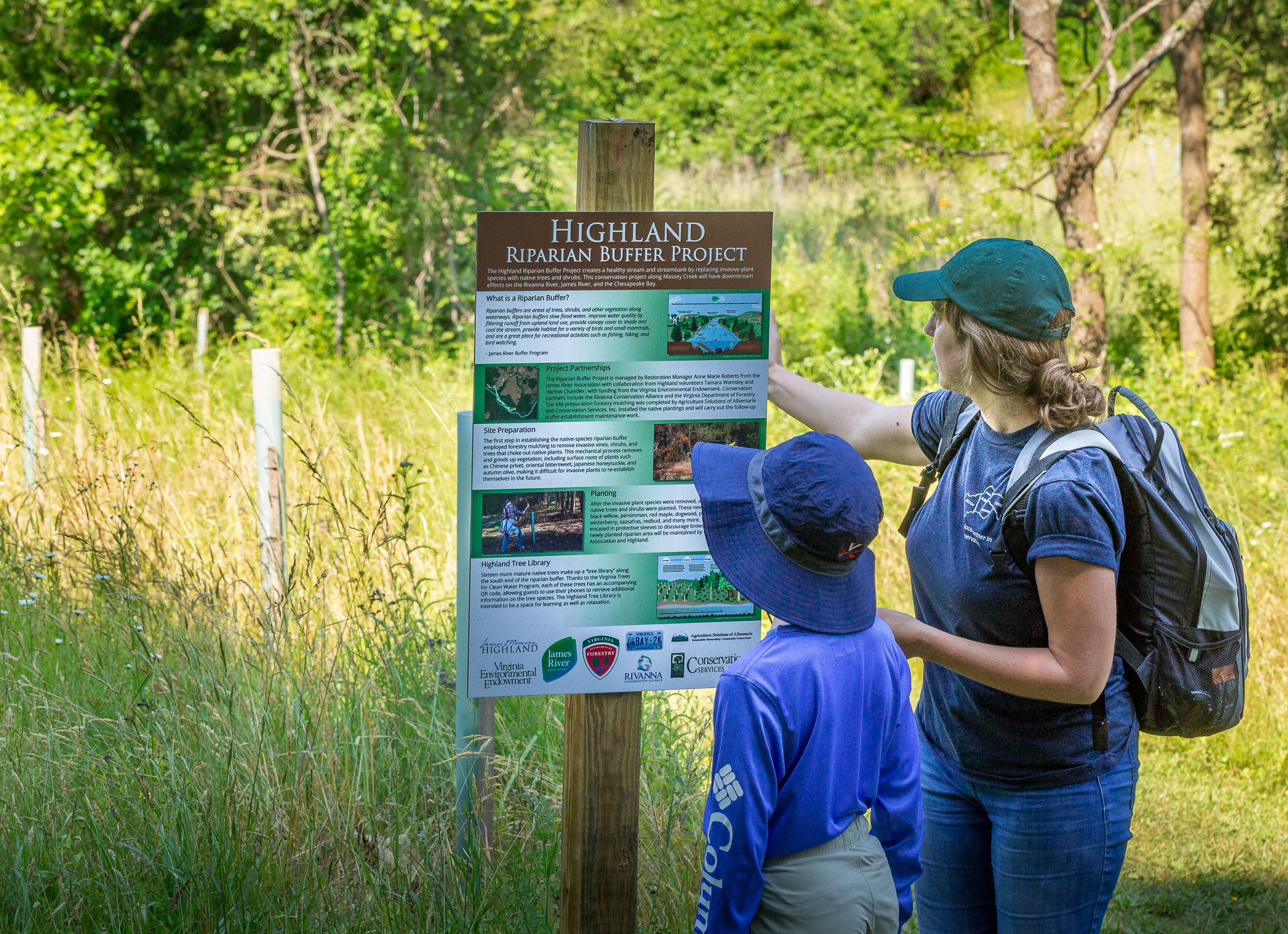 Visitors to Highland viewing an interpretive sign