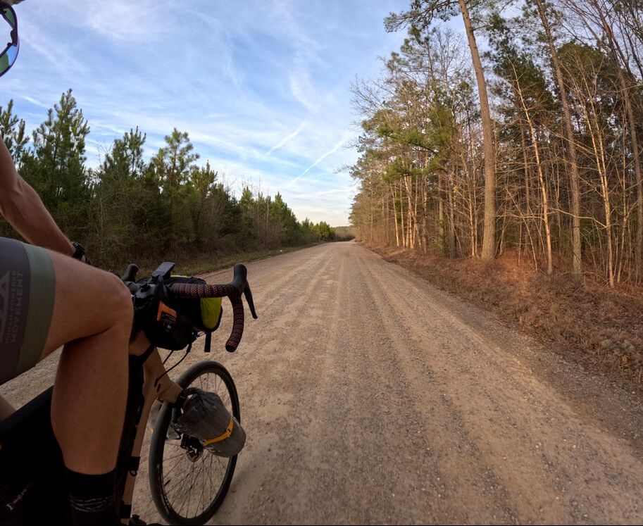 Bratton riding along a dirt road
