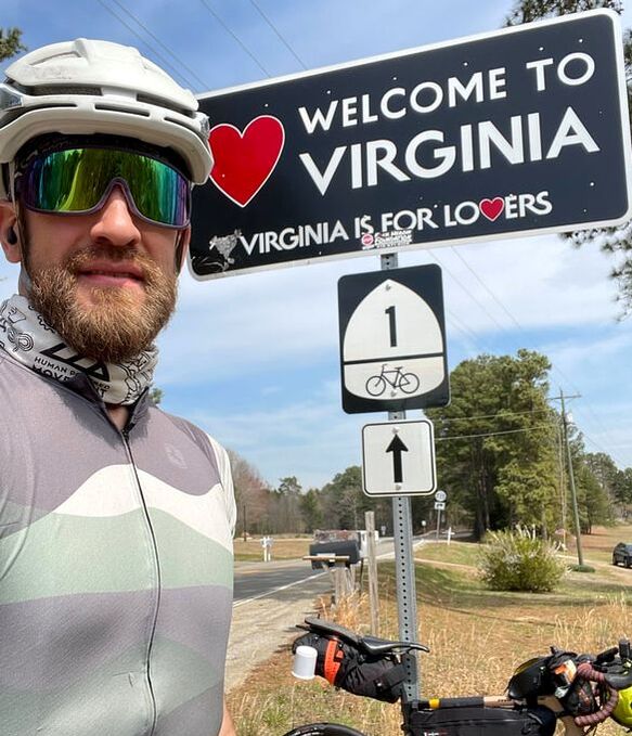 Bratton at a "Virginia is for Lovers" sign