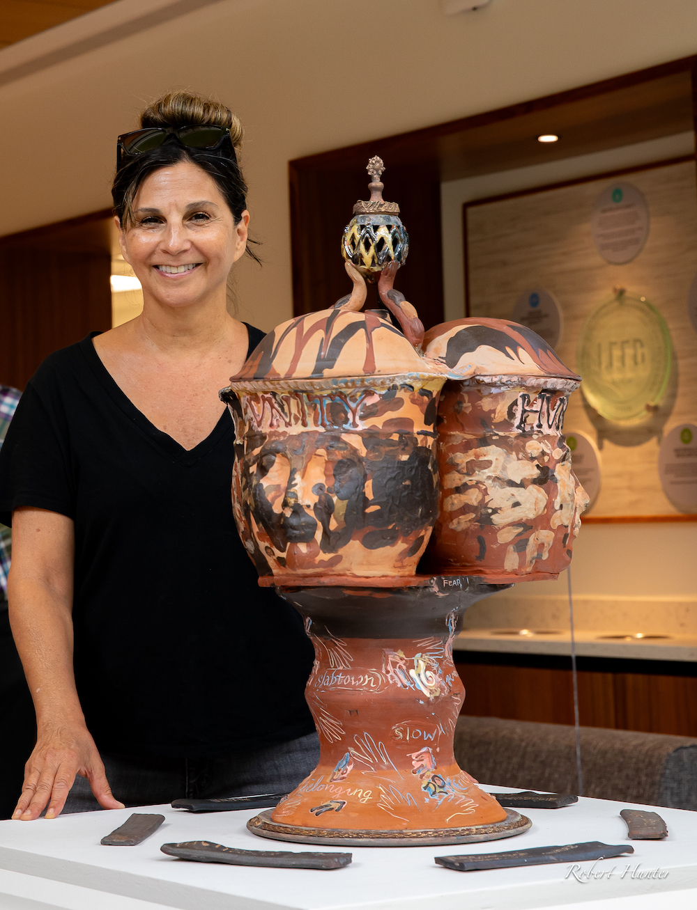 Erickson with the completed "Unity" ceramic (photo by Robert Hunter M.A. 87)