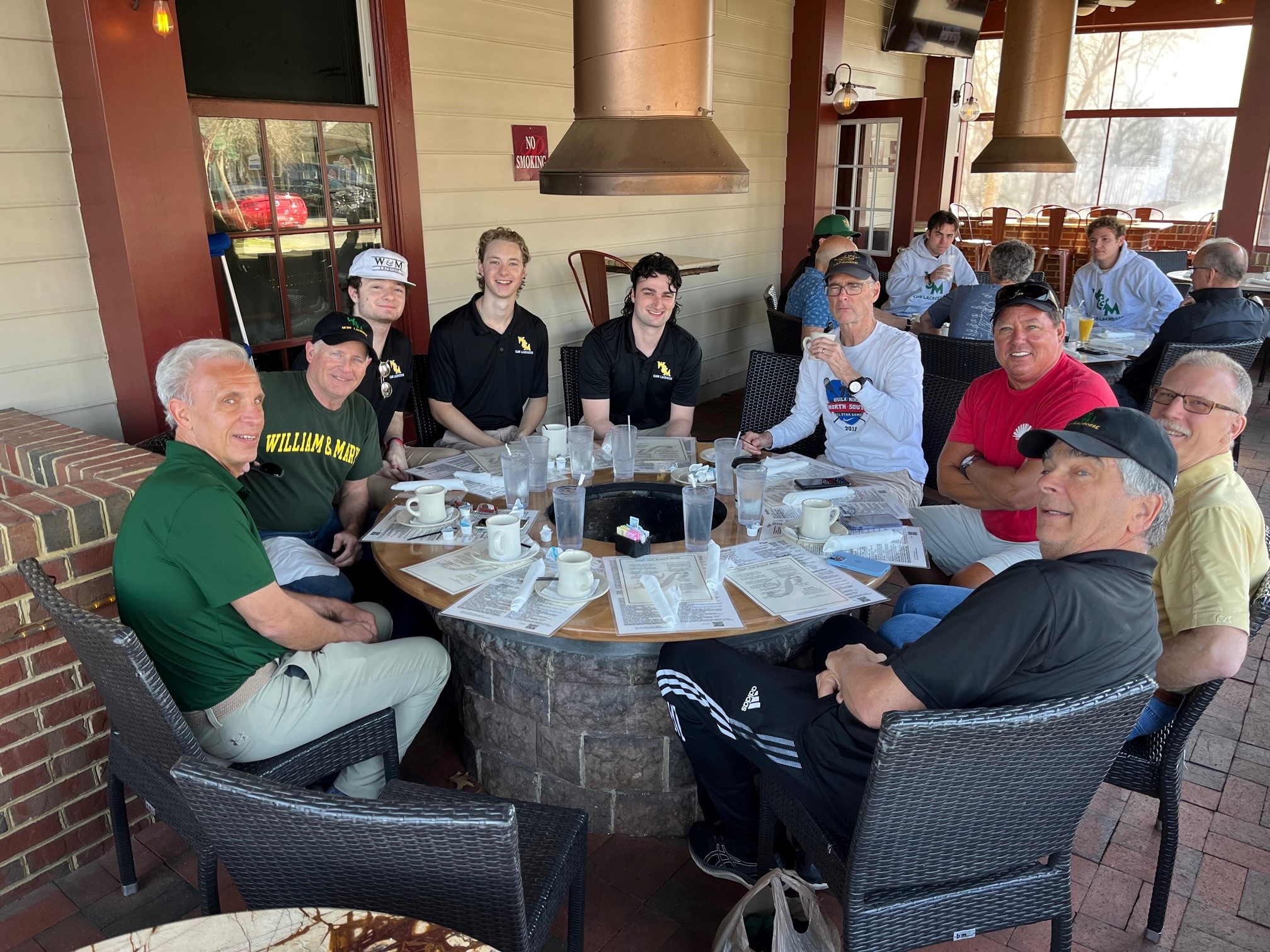 Lacrosse alumni having lunch with members of the current club team
