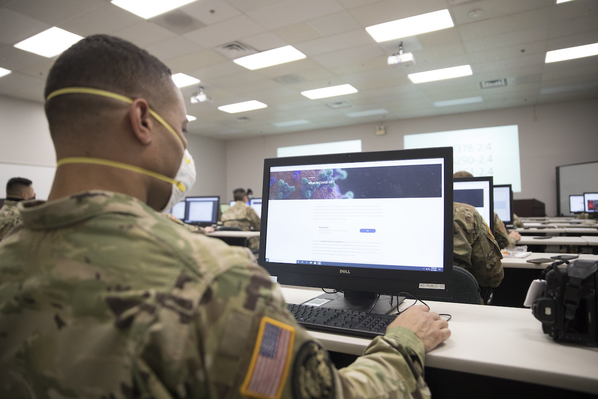 Members of the Delaware National Guard assist with contact tracing for COVID-19 cases at the State Health Operations Center.   