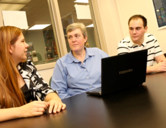 Government department chair Sue Peterson talks with students