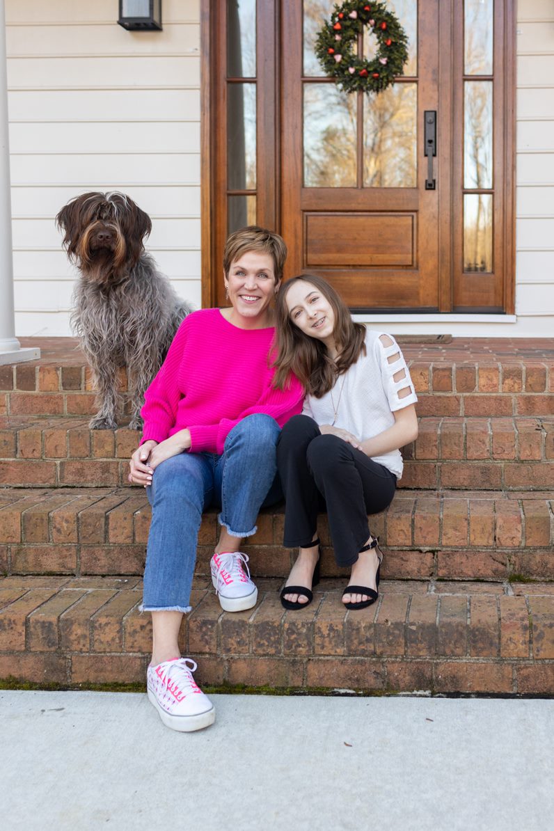 Megan Sumrell with her daughter and her dog