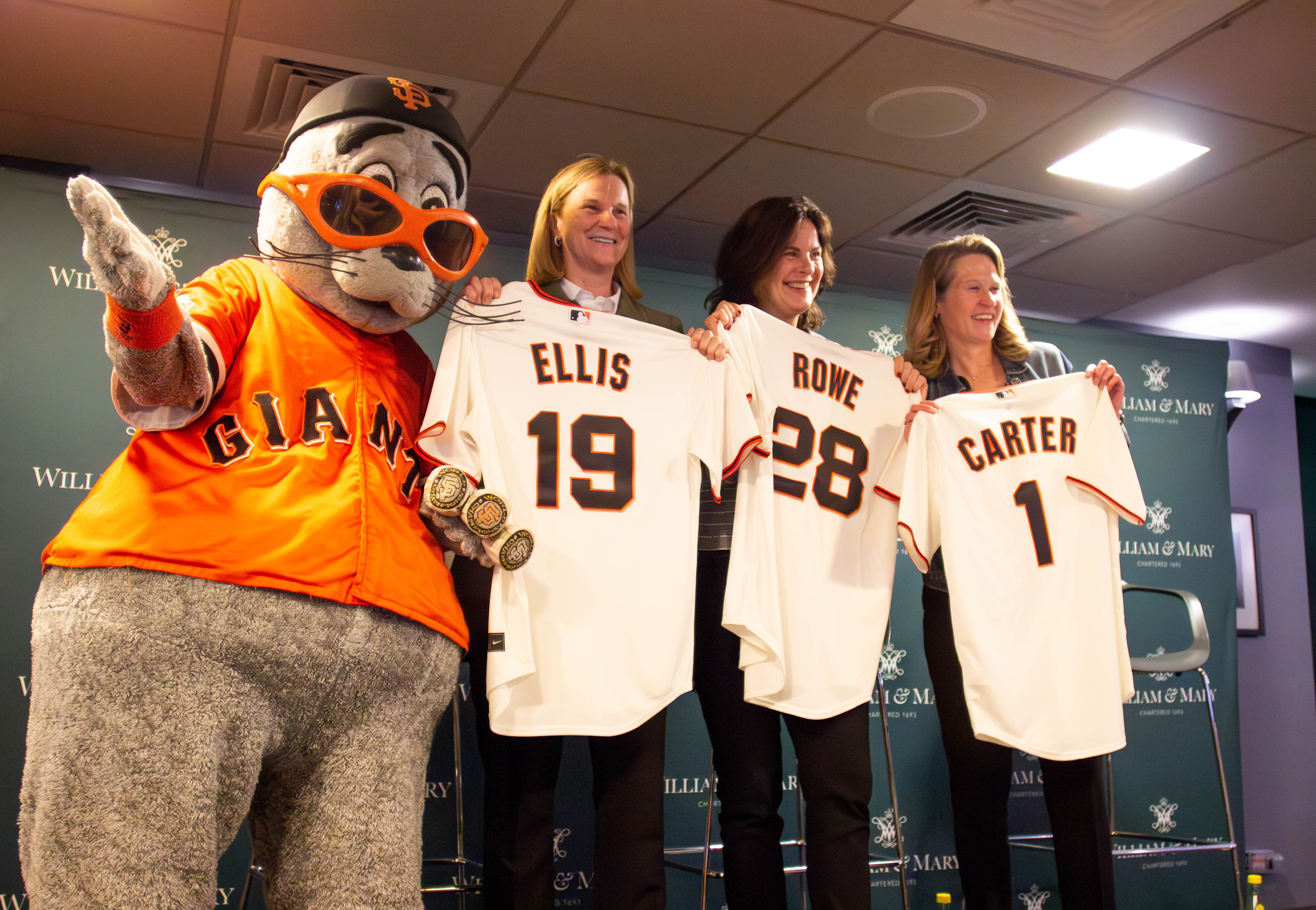 President Rowe, Jill Ellis and Kathy Carter received Giants jerseys from their mascot.